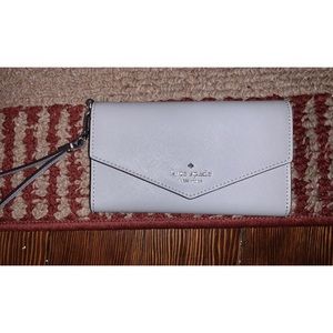Grey/silver Kate Spade wristlet and phone carrier